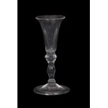 18th Century wine glass, the bell bowl above a inverted baluster stem with a basal knop and domed
