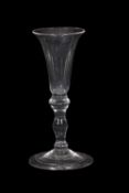 18th Century wine glass, the bell bowl above a inverted baluster stem with a basal knop and domed