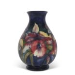 Large mid 20th Century Moorcroft vase the blue ground with tube-lined decoration in the orchid