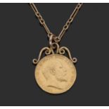Edward VII sovereign dated 1907 framed in a pendant mount suspended from a 15ct marked trombone link