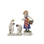 Pair of Naples early 20th Century figures of athletes together with a continental porcelain figure