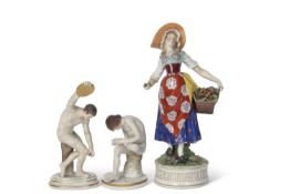 Pair of Naples early 20th Century figures of athletes together with a continental porcelain figure