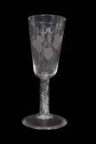 Air twist cordial glass, the bowl engraved with ears of corn above an air twist stem, 18cm high