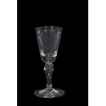 18th Century wine glass funnel bowl above a baluster stem, 14cm high