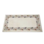 India Agra marble table top of rectangular form, the border inlaid with a floral and vine design