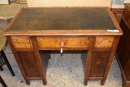 Small late 19th or early 20th Century oak desk with integral shelves to the sides, 94cm wide