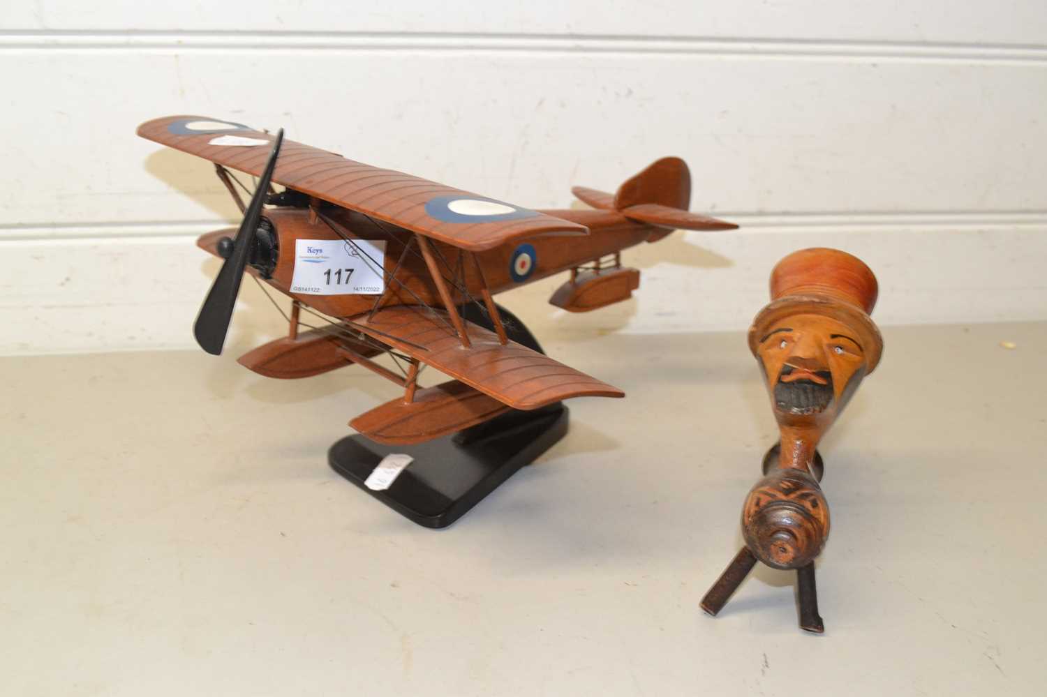 Model plane and figural tobacco pipe