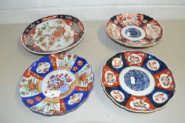 Four various Imari wall plates