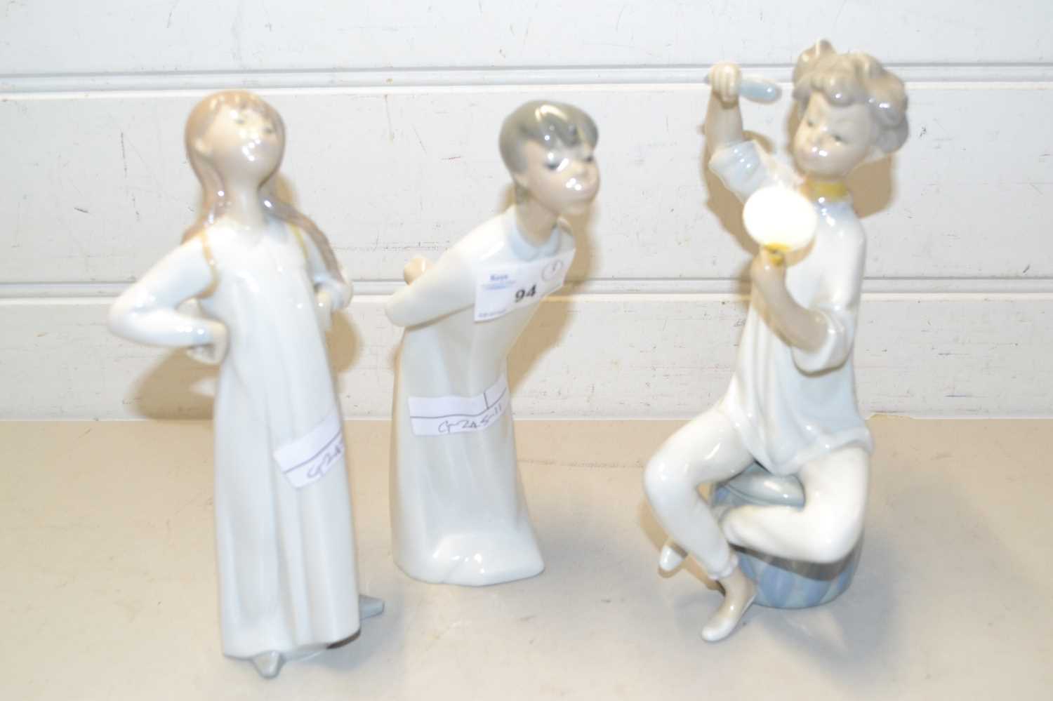 Two Lladro figures and one other