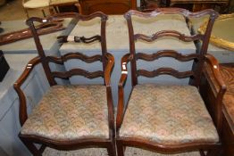 Pair of Hepplewhite style pierced mahogany ladder back carver chairs, one with damaged back