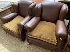 Pair of brown studded leather easy chairs