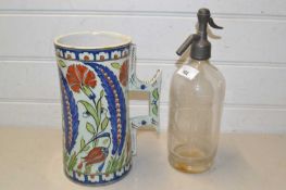 Soda syphon and a large pottery mug