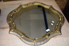20th Century wall mirror with mirror faceted frame and metal mounts