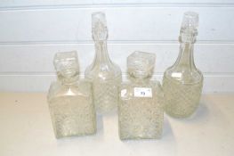 Four various assorted decanters