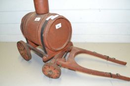 Travelling salesman sample, a wooden model of a water bowser
