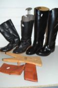 Two pairs of various riding boots and boot jack