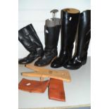 Two pairs of various riding boots and boot jack