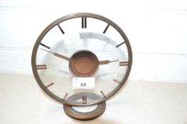 An early 20th Century mantel clock with glass dial in the Art Deco style
