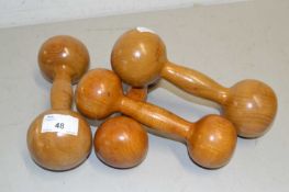 Four wooden dumbells