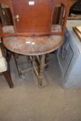 Small oak circular topped table with carved decoration