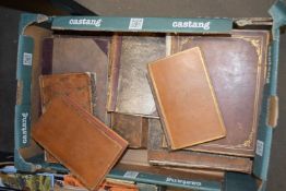 Box of leather bound books