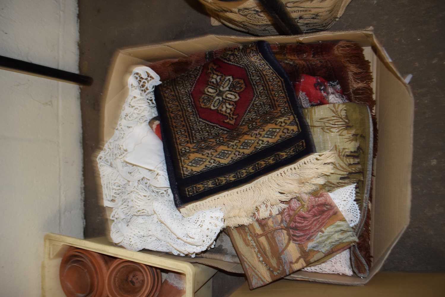 One box of various small rugs, wall hangings etc