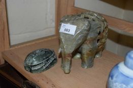 Modern polished stone model of an elephant together with a polished stone model of an Egyptian