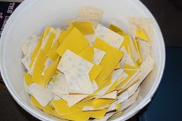 Large quantity of yellow sand paper