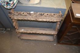 Carved wooden wall shelf with floral decoration, approx 80cm wide