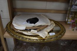 Oval wall mirror, gilt framed together with a quantity of 78 rpm records