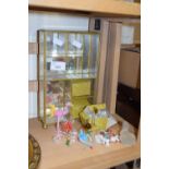 Small table top display cabinet and a collection of various glass animals