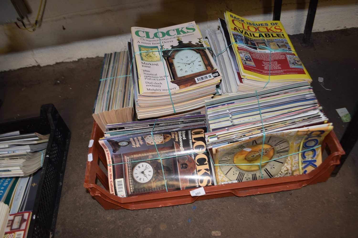 Large quantity of magazines, clocks