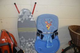 Ironing board and a highchair