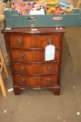 Reproduction serpentine front four drawer chest