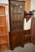 Reproduction mahogany corner display cabinet of concave form