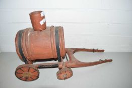 Travelling salesman sample, a wooden model of a water bowser