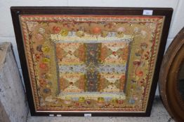 Indian needlework panel decorated with squares and scrolled detail, oak framed, 68cm wide
