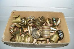 Box containing a collection of various metal bangles