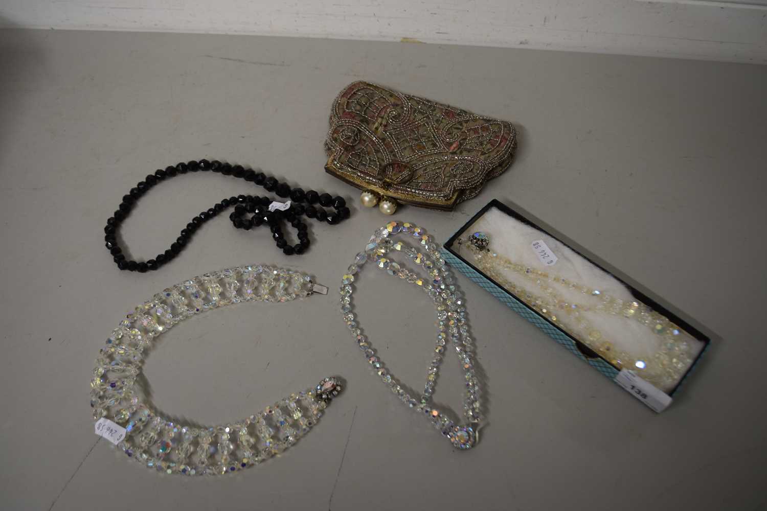 Mixed Lot: Costume necklaces and a small evening bag