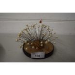 Cork pin cushion with a selection of pins with simulated pearl mounts