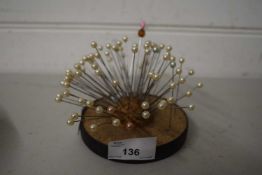 Cork pin cushion with a selection of pins with simulated pearl mounts