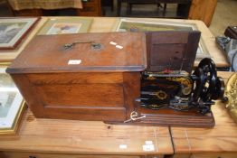 Vintage Singer sewing machine in hardwood case
