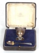 Cased George V christening egg cup and spoon of plain design but bearing initials, London 1946/52,