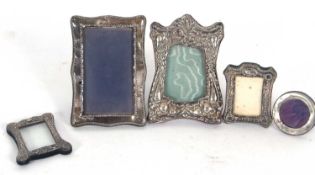Mixed Lot: Group of four hallmarked silver/white metal mounted photograph frames, the largest