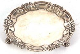 Small Edwardian waiter of shaped circular form with wavey edge in George II style, plain centre,