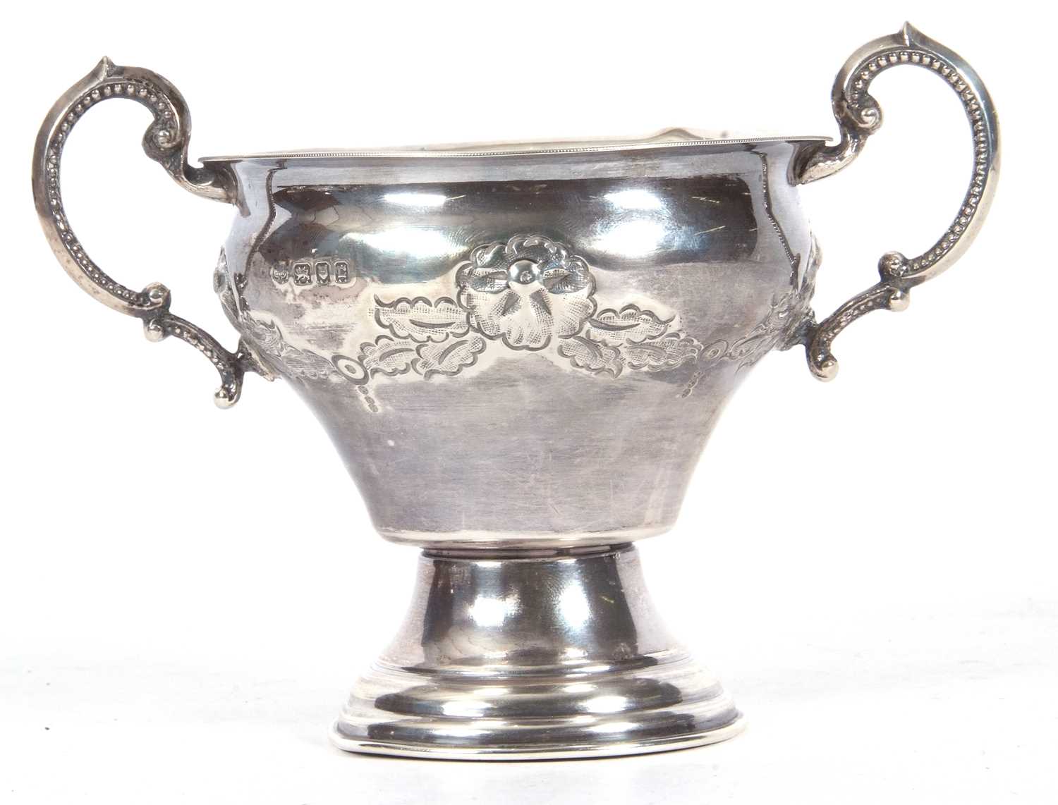 George V silver twin handled vase of baluster form, the body decorated with a garland of flowers and - Image 2 of 4