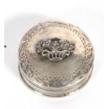 Elizabeth II circular lidded box, the lid with engraved edge and centre raised motif of a basket