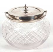 George V cut glass and silver biscuit barrel of bulbous form with integral swing carrying handle and