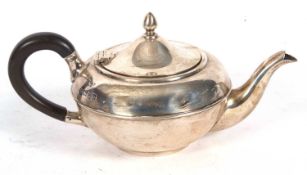 George V silver bachelors teapot having a domed hinge lid with acorn finial, reeded banded body