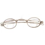 Cased pair of William IV silver framed spectacles with oval lenses, articulated side arms, London,